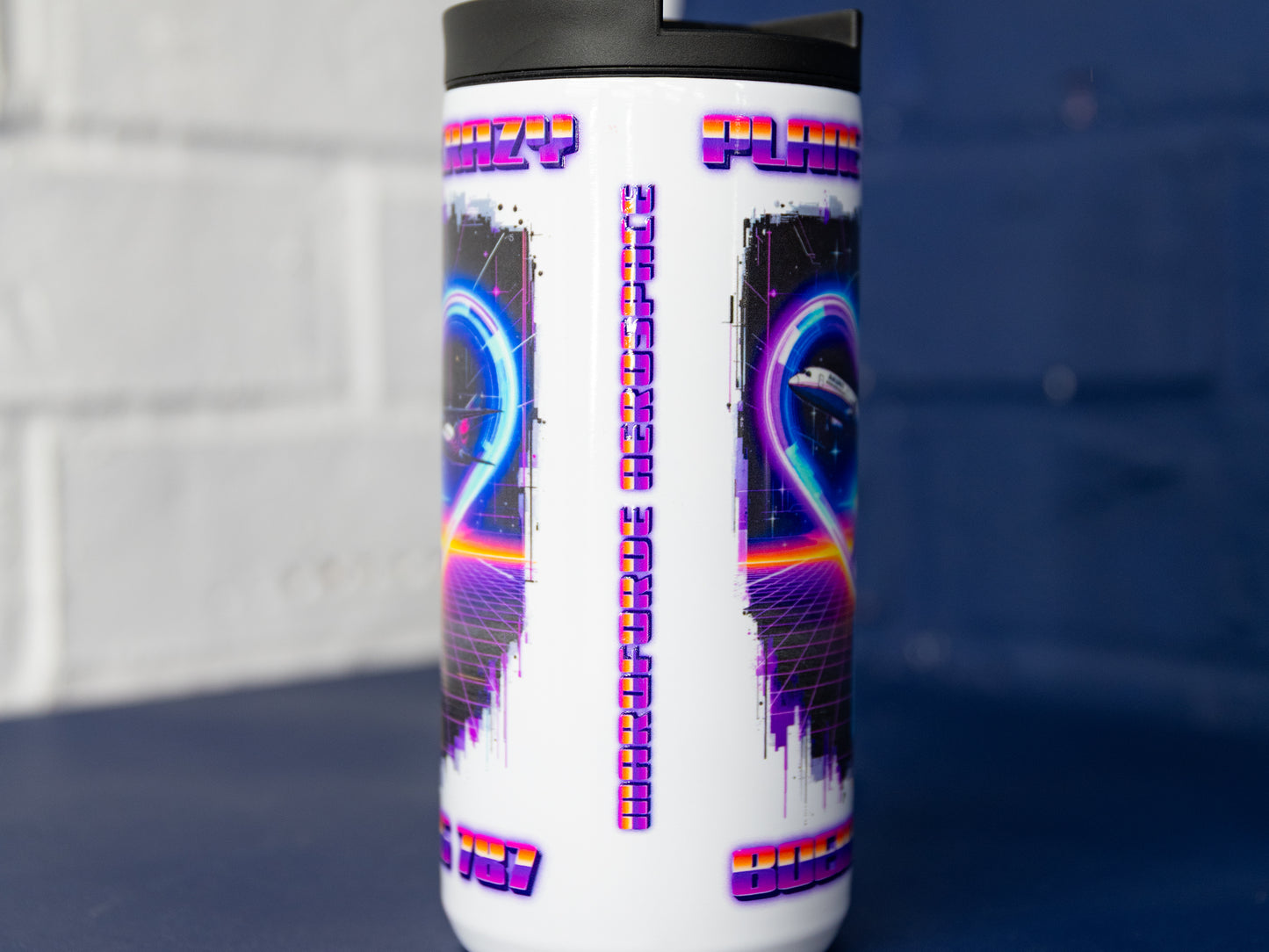 Side view showing repeating Plane Crazy graphics on gloss white body.