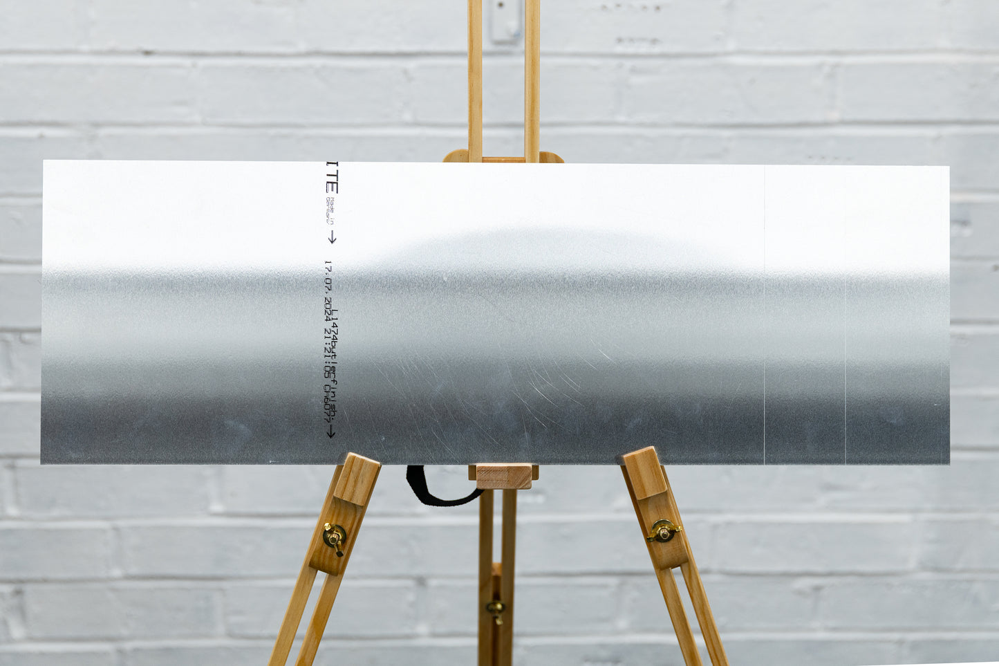 Back of brushed aluminium panoramic panel showing clean, unmarked surface from ex-display sample.