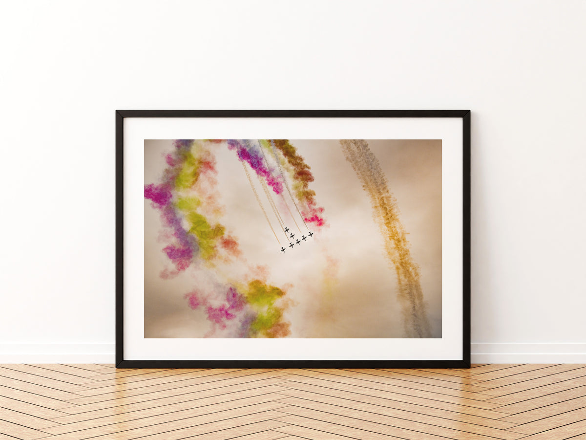 Al Fursan UAE aerobatic team looping through coloured smoke, aviation photo wall art print in a black frame