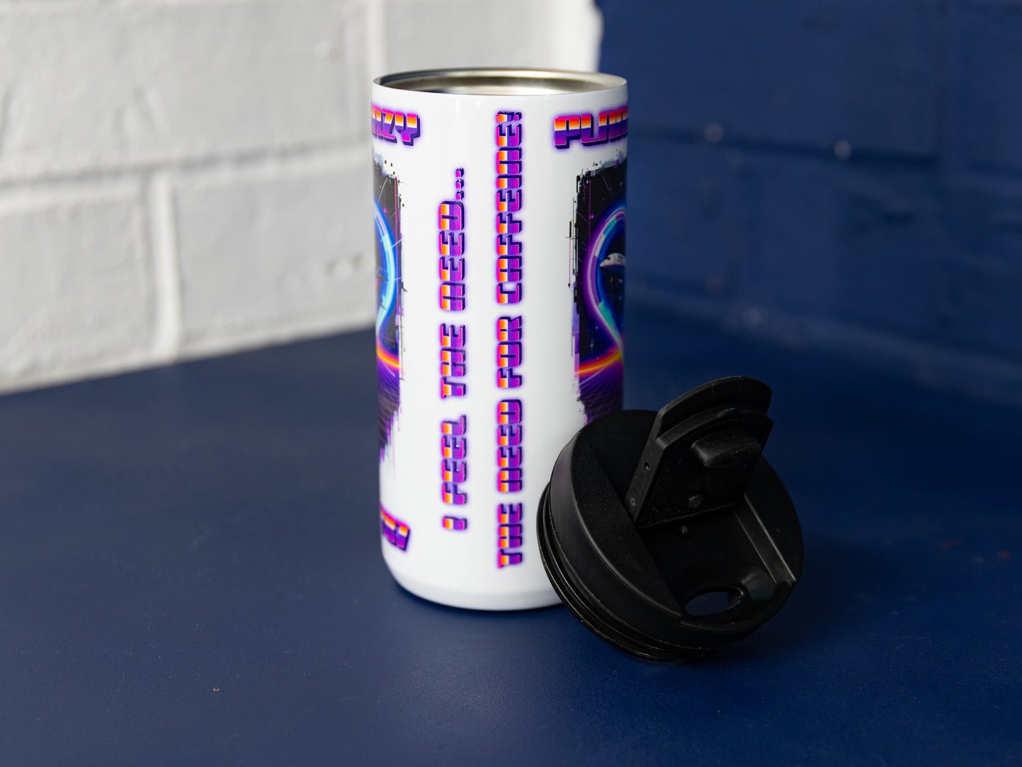 Back view with slogan text “I feel the need for caffeine!”.