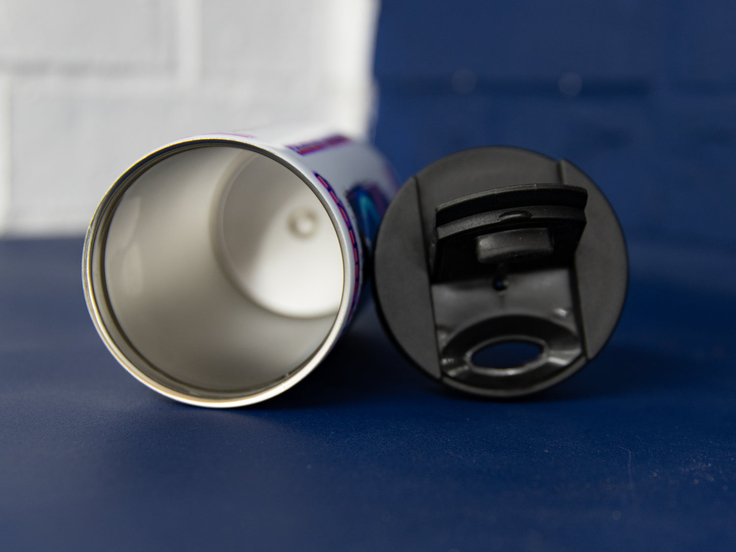 Interior view and separate flip lid of stainless steel bottle.