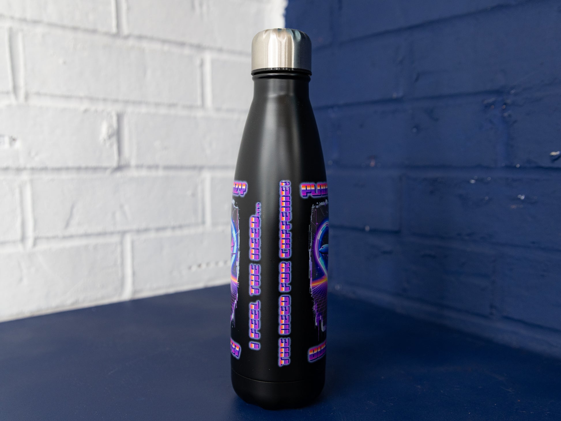 Rear angled view showing repeat graphics down the sides.