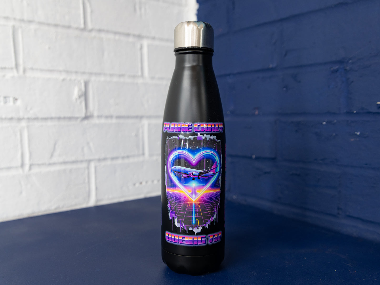 Straight-on front view highlighting full design on matte black body.