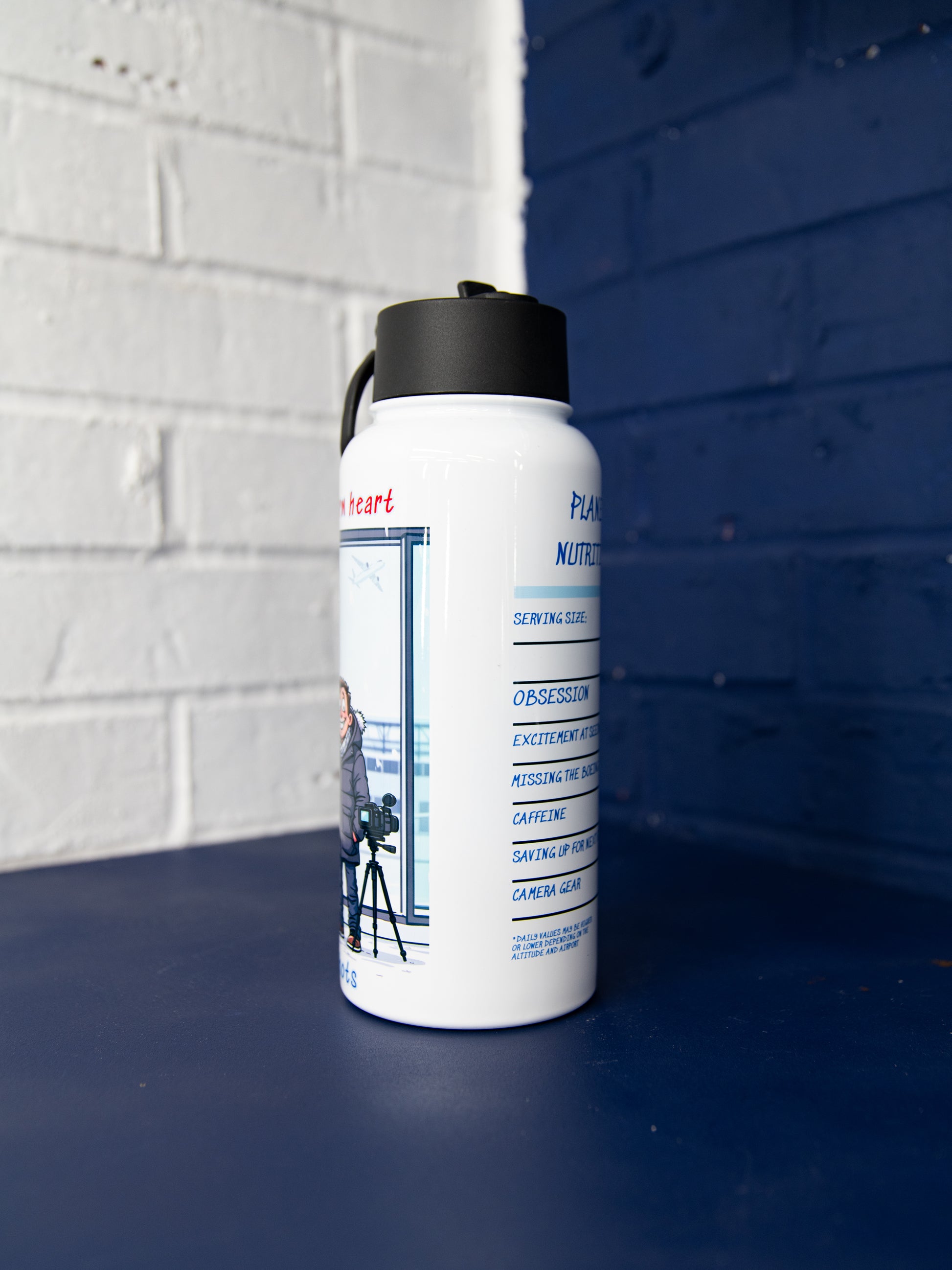 Side view of white bottle showing “Plane Lover Nutrition Facts” panel and black lid.