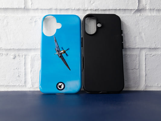 Flat front view of Spitfire case and black insert side by side against a white brick wall.