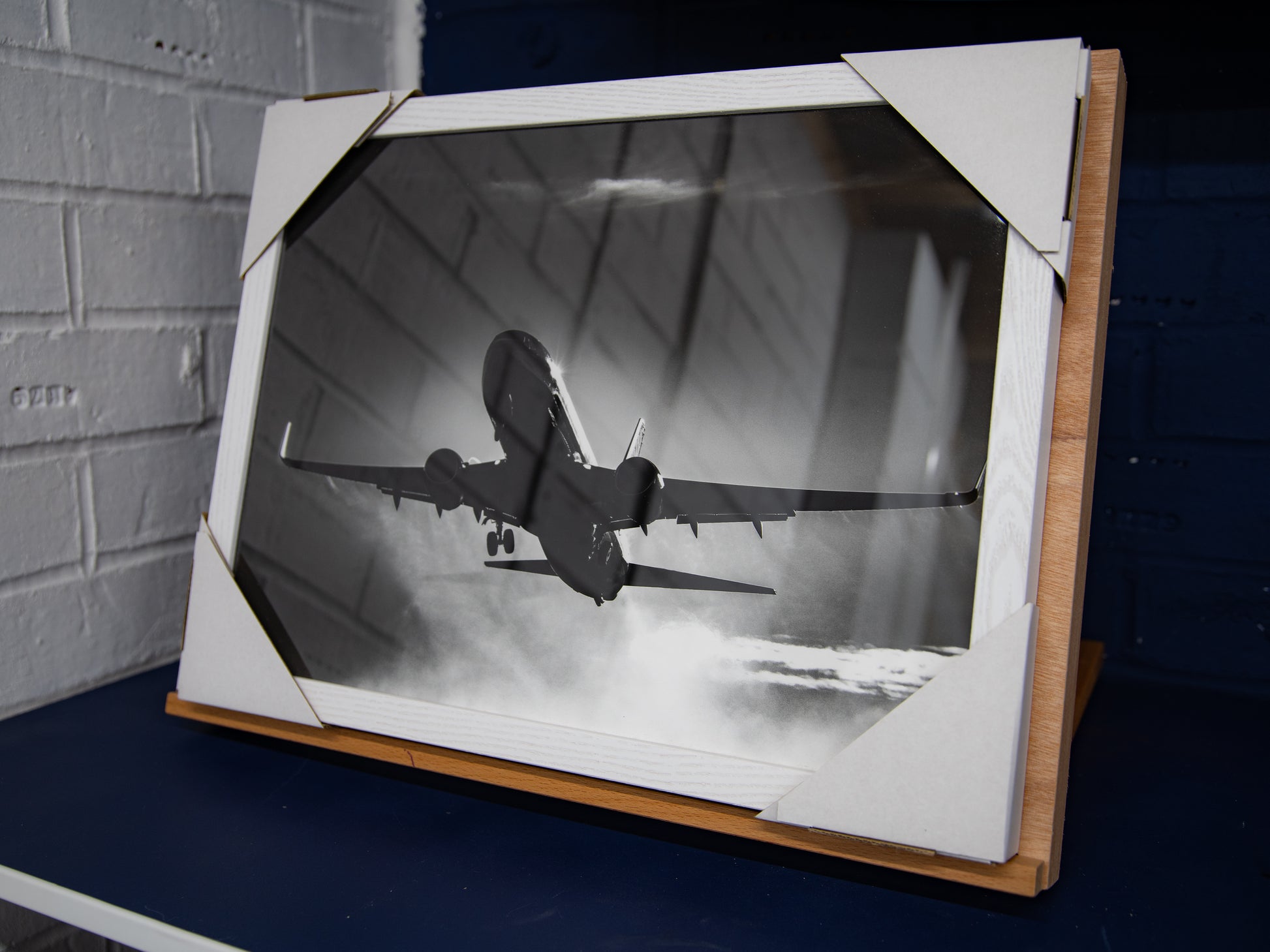 Front view of framed Jet2 Boeing 737 departure print with corner protectors in place.