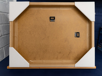 Rear of frame showing ash surround and two wall-mount hangers.