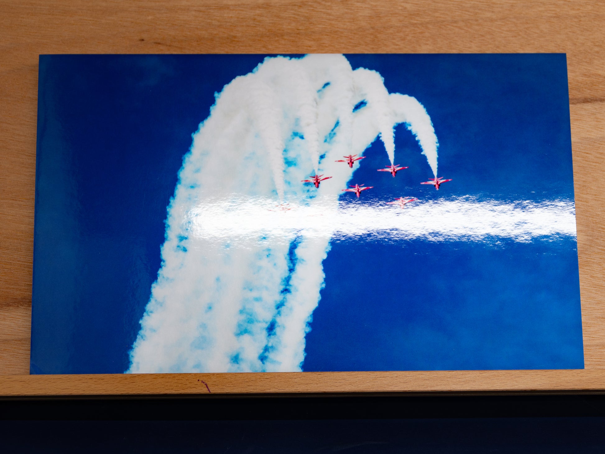 Overhead shot highlighting the glossy metallic finish across the print.