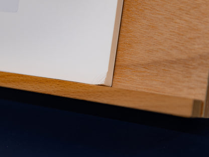 Corner close-up showing minor damage on the rear foamboard.