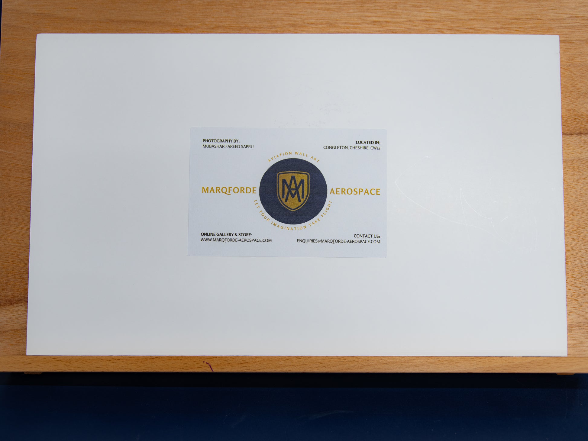 Reverse of foamboard print with Marqforde label at centre.