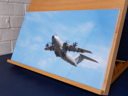 Angle front view of Airbus A400M climbing after takeoff — glossy photo print mounted on foamboard
