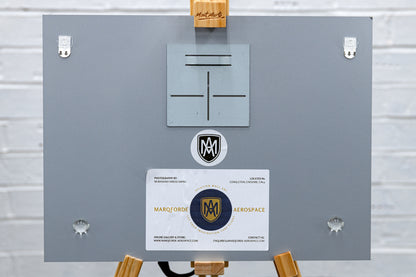 Back of the brushed aluminium print with float-mount plate, rubber bumpers and maker label.