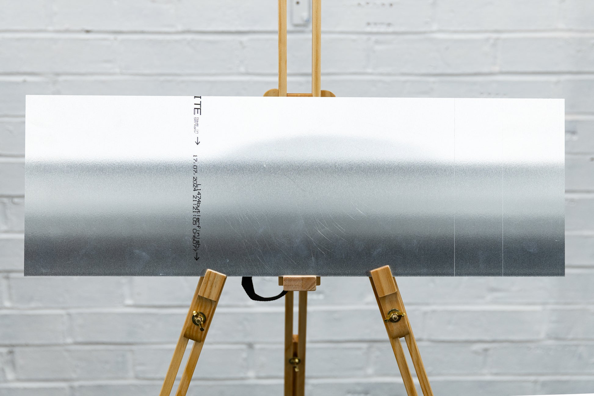 Back of brushed aluminium panoramic panel showing clean, unmarked surface from ex-display sample.