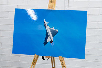 Ex-display glossy foamboard print of Austrian Eurofighter Typhoon climbing against clear blue sky, three-quarter angle.
