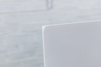 Close-up of rear corner of 10 mm foamboard showing small scuff from display