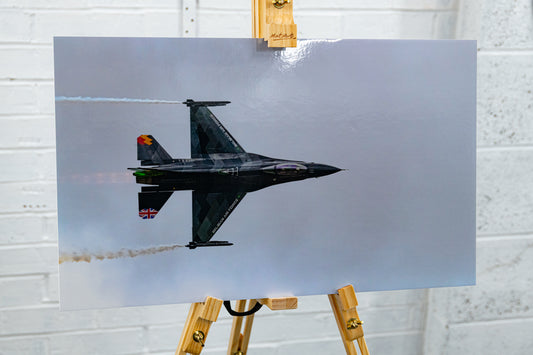 Three-quarter view of the metallic print on easel, highlighting the knife-edge pass composition.