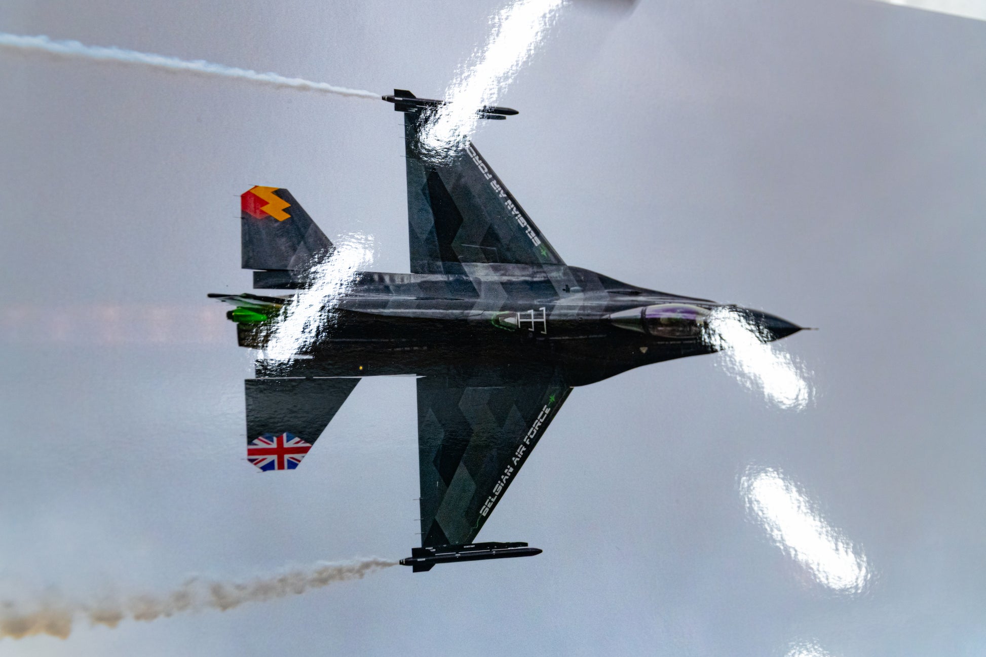 Detail of the Belgian Air Force F-16 “Dream Viper” knife-edge pass on metallic photo paper, glossy sheen visible.