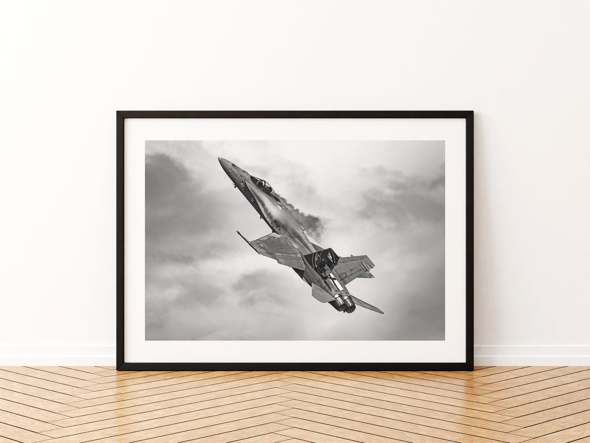 Finnish Air Force F/A-18 Hornet hauling into a climb, black and white, aviation photo wall art print in a black frame
