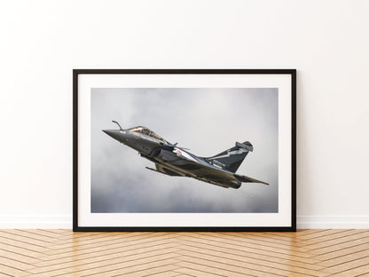 French Navy Dassault Rafale M banking under grey cloud, aviation photo wall art print in a black frame