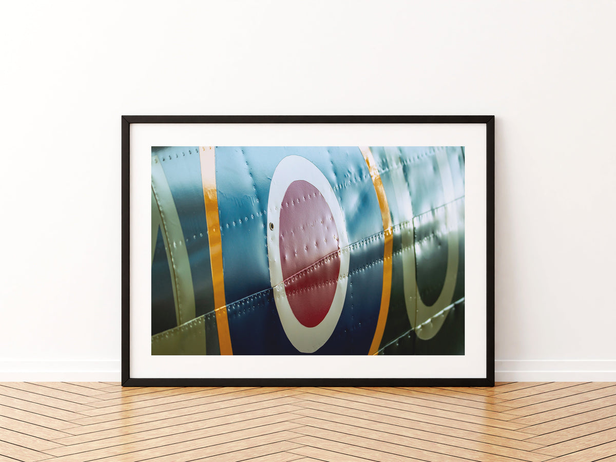 Close-up of the fuselage roundel and riveted panels of Spitfire RW388, aviation photo wall art print in a black frame