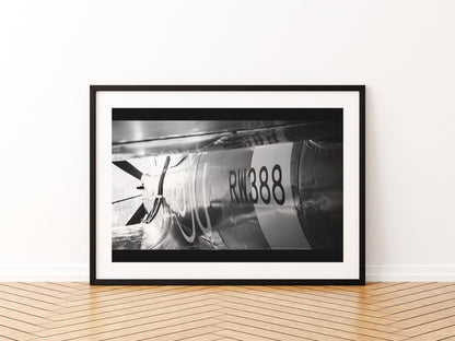 Rear fuselage and serial RW388 of a Spitfire in a panoramic black and white close-up, aviation photo wall art print in a black frame