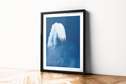 Black Eagles T-50B jets topping a loop with white smoke, aviation photo wall art print in a black frame