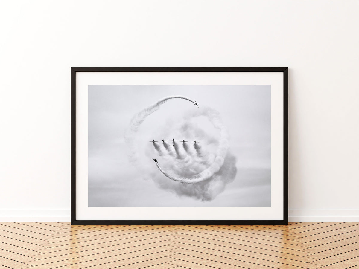 Five Red Arrows Hawks in formation inside a ring of smoke, black and white aviation photo wall art print in a black frame