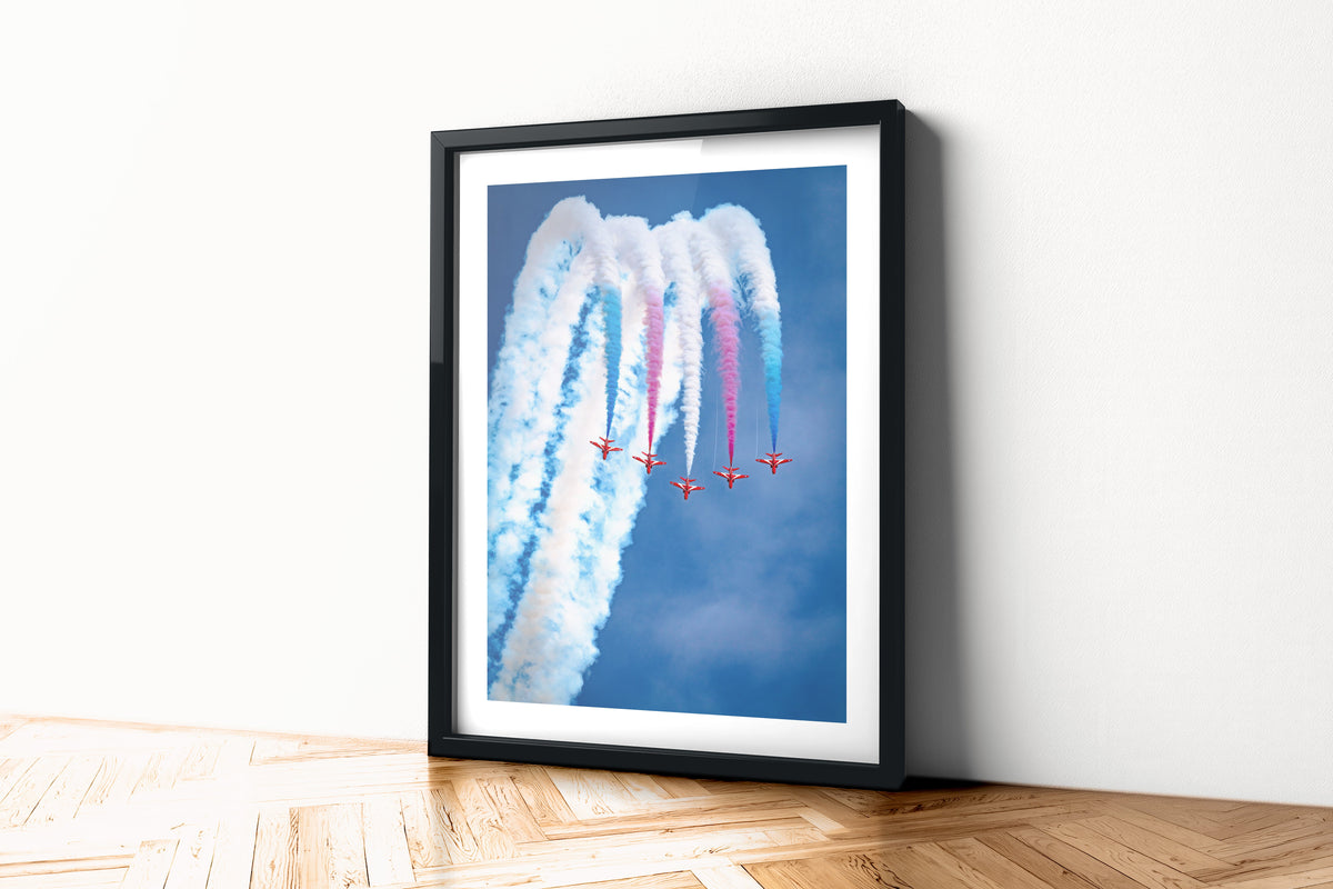 Red Arrows Hawks topping a loop in Apollo formation with red, white and blue smoke, aviation photo wall art print in a black frame