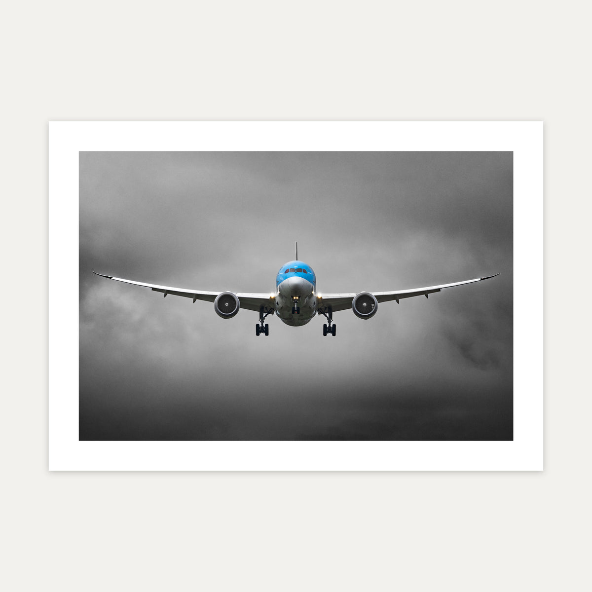 TUI Boeing 787 Dreamliner head-on on final approach, wings flexed, under dark grey cloud, unframed A4 aviation photo print