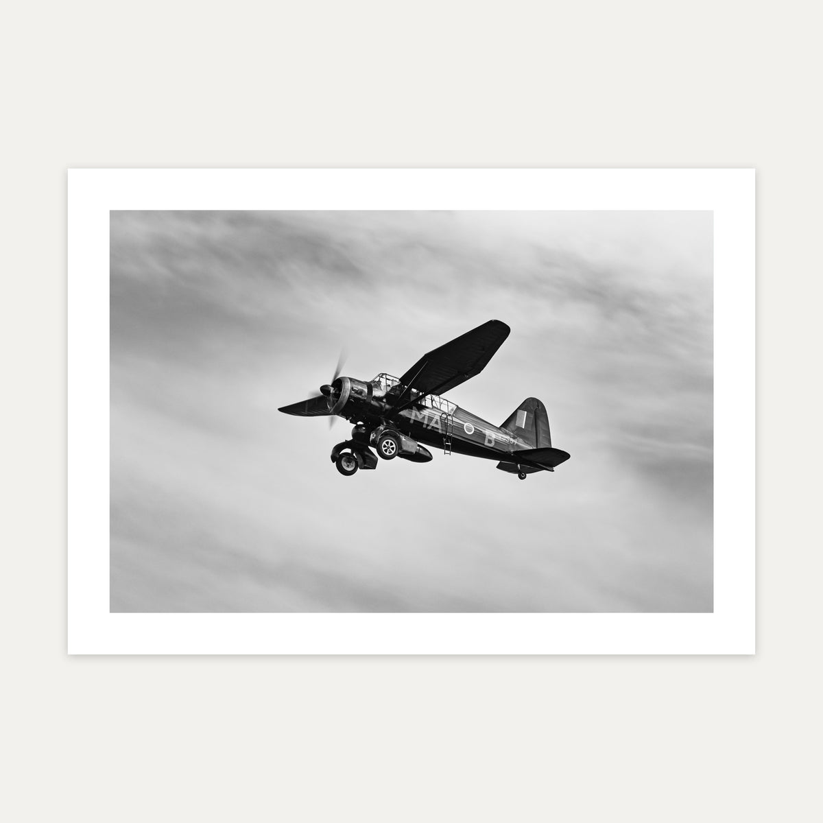 Westland Lysander banking under a streaked sky, black and white, unframed A4 aviation photo print