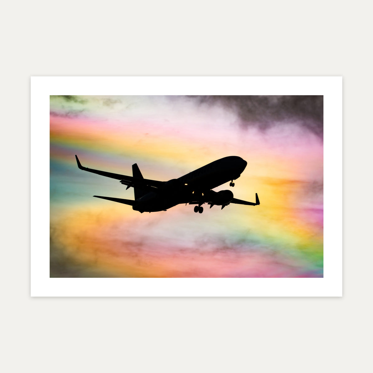 Ryanair Boeing 737-800 silhouetted against rainbow-coloured iridescent cloud on approach, unframed A4 aviation photo print