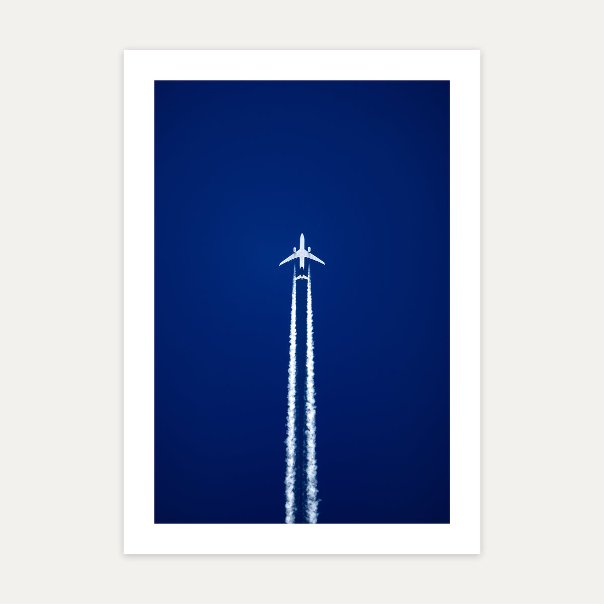 Airbus A330 at cruising altitude trailing twin contrails across a deep blue sky, unframed A4 aviation photo print
