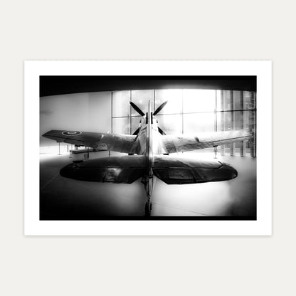 Spitfire RW388 seen from behind, backlit by a gallery window, black and white, unframed A4 aviation photo print